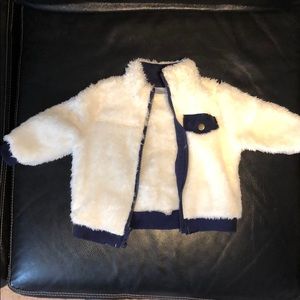 White Faux Fur baby jacket with blue trim